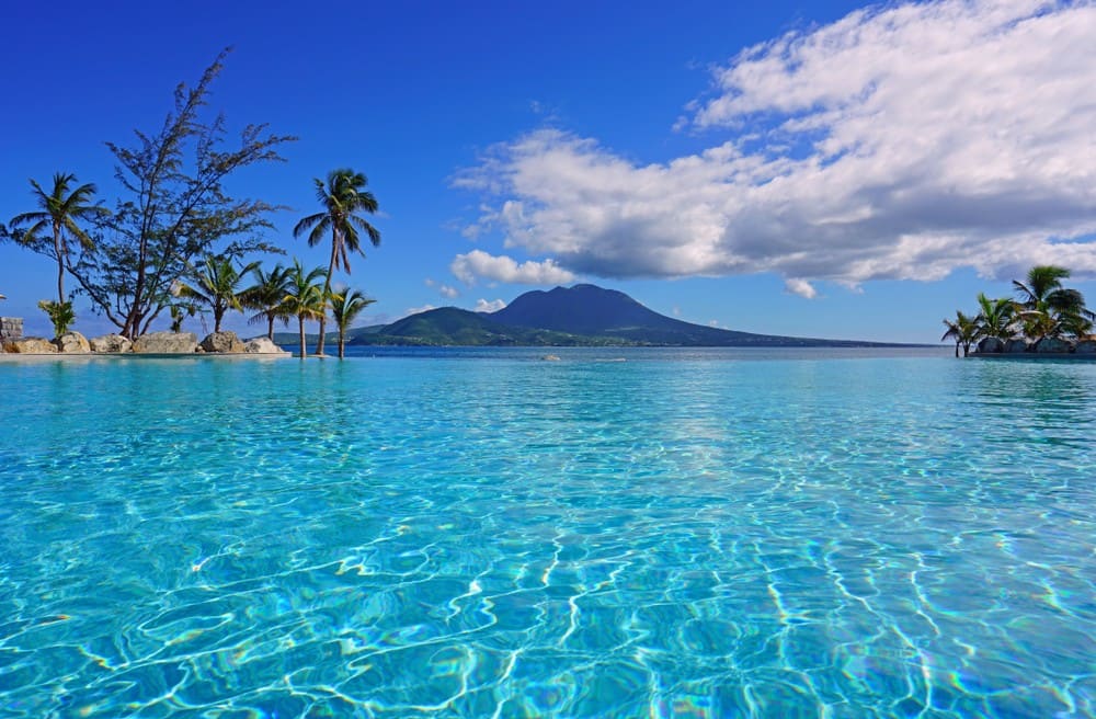 Nevis Peak across clear turquoise water